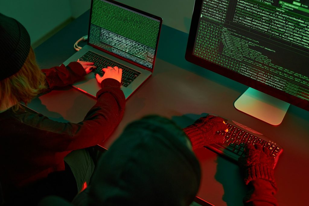 Cyber war. Hackers breaking security. Anonymous people access sensitive data. Cyber attack. Coding